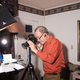 Gem and mineral photographer Jeff Scovil at work in a makeshift studio in his hotel room during the Gem Show.
